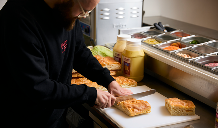 chef will steel cutting a foccacia